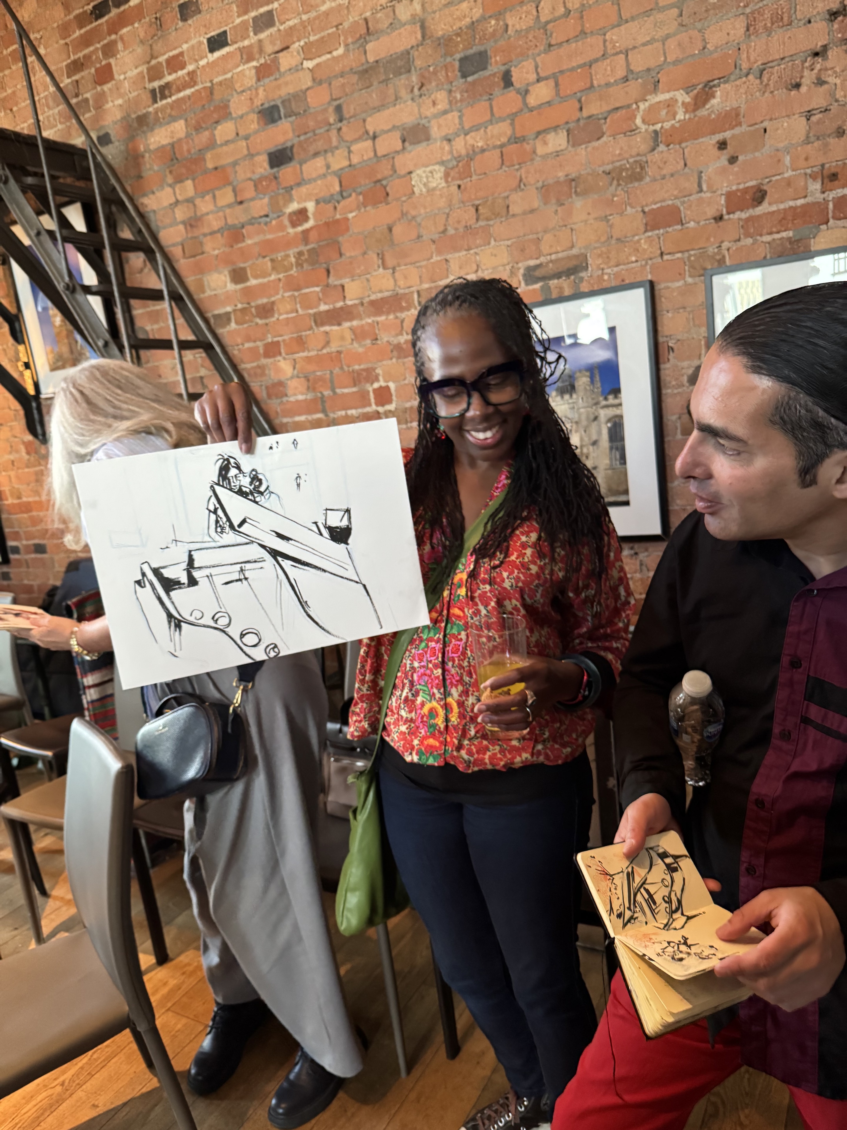 Guests sharing a line drawing after the Clock Tower concert